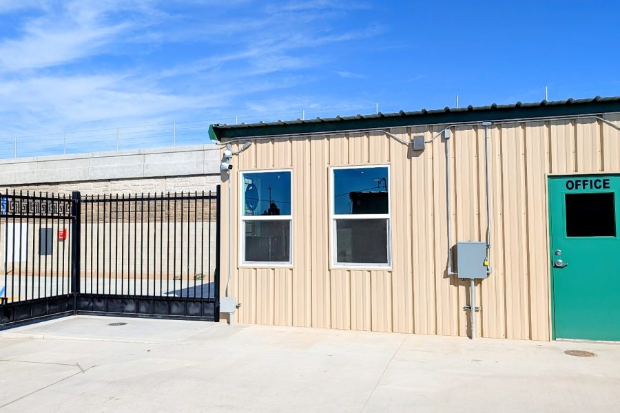 Office entrance and security gate at Wasco Mini Storage in California