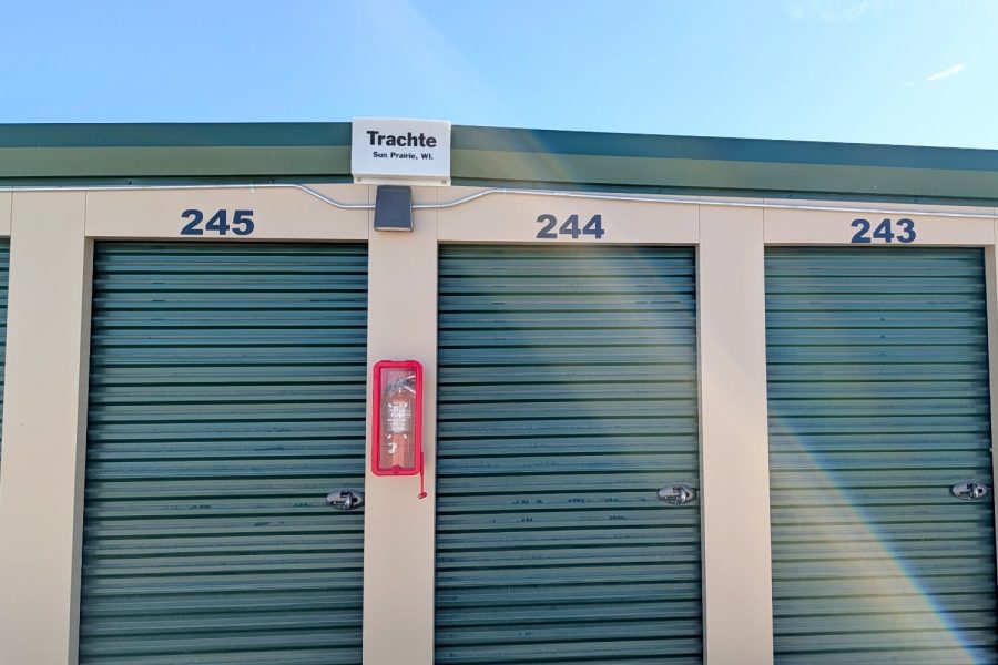 Numbered green self storage doors at Wasco Mini Storage in CA